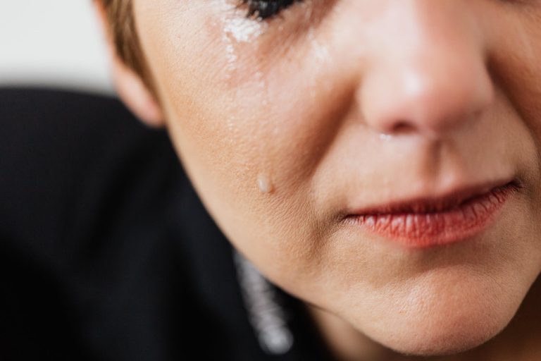 middle aged woman crying with tears